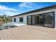 This beautiful deck offers glass railings and access to the living room at 182 N Phelps Ave, Winter Park, FL 32789