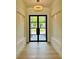 Bright foyer with wood flooring, recessed lighting, and modern light fixture, creates an elegant entry at 182 N Phelps Ave, Winter Park, FL 32789