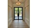 Bright entryway featuring a modern door, light wood floors, and recessed lighting at 182 N Phelps Ave, Winter Park, FL 32789