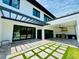 Exterior featuring a covered patio with kitchen and backyard with pool at 182 N Phelps Ave, Winter Park, FL 32789