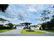 Striking new home with lush landscaping, geometric paver driveway, three car garage and modern design at 182 N Phelps Ave, Winter Park, FL 32789