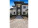 Modern home featuring a striking front entrance, landscaped yard, and manicured curb appeal at 182 N Phelps Ave, Winter Park, FL 32789