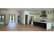 Open-concept kitchen and living area with stainless steel appliances and a large kitchen island at 182 N Phelps Ave, Winter Park, FL 32789