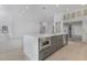 This kitchen features stainless steel appliances, a gray kitchen island, and lots of lighting at 182 N Phelps Ave, Winter Park, FL 32789