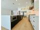 Kitchen with a large island, stainless appliances and sleek modern design at 182 N Phelps Ave, Winter Park, FL 32789