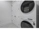 This laundry room features a stacked washer/dryer and closet at 182 N Phelps Ave, Winter Park, FL 32789