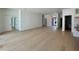 Spacious living room with hardwood floors, white walls, and ample natural light at 182 N Phelps Ave, Winter Park, FL 32789