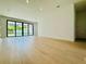 Bright, open living room with large glass sliding doors leading to the backyard pool at 182 N Phelps Ave, Winter Park, FL 32789