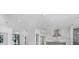 Bright open-concept room with stainless steel appliances, modern lighting, and views of the front yard at 182 N Phelps Ave, Winter Park, FL 32789