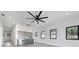 The light filled living room offers a ceiling fan and built-in wet bar at 182 N Phelps Ave, Winter Park, FL 32789