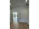 Bright living room with hardwood floors and doors leading to the backyard pool at 182 N Phelps Ave, Winter Park, FL 32789
