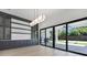 Open living area featuring modern cabinetry and large sliding doors to the outdoor living space at 182 N Phelps Ave, Winter Park, FL 32789
