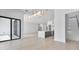 Bright living space featuring an open floor plan, tile floors, and staircase to second story at 182 N Phelps Ave, Winter Park, FL 32789