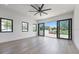 A main bedroom boasts hardwood floors, recessed lighting, and sliding glass doors at 182 N Phelps Ave, Winter Park, FL 32789