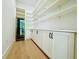 Spacious pantry with custom shelving, ample cabinet space and a wine cooler at 182 N Phelps Ave, Winter Park, FL 32789