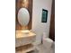 Stylish powder room with decorative vanity, a round mirror, and a contemporary toilet at 182 N Phelps Ave, Winter Park, FL 32789