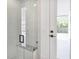 Contemporary shower featuring a glass door and bench at 182 N Phelps Ave, Winter Park, FL 32789