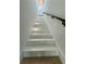 Bright stairway with recessed lighting, modern handrail and wood flooring at 182 N Phelps Ave, Winter Park, FL 32789