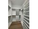 Walk-in closet with custom shelving and drawers at 182 N Phelps Ave, Winter Park, FL 32789