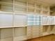Spacious walk-in closet featuring custom shelving, cabinets, drawers and modern design elements at 182 N Phelps Ave, Winter Park, FL 32789