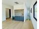Stylish wet bar featuring marble counters, custom tile backsplash, and a wine fridge at 182 N Phelps Ave, Winter Park, FL 32789