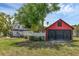 Charming backyard with a detached two-car garage and a white picket fence at 1901 10Th St, St Cloud, FL 34769