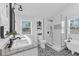 Elegant bathroom with a double sink, modern shower, and stylish black and white patterned tile floor at 1901 10Th St, St Cloud, FL 34769