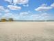 A serene beach scene complete with soft sand and a volleyball net at 1901 10Th St, St Cloud, FL 34769