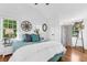 Inviting bedroom with large windows, a vaulted ceiling, and stylish decor with a comfortable bed at 1901 10Th St, St Cloud, FL 34769