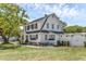 Charming two-story home with classic architectural style, landscaping and a lush green lawn at 1901 10Th St, St Cloud, FL 34769