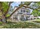 Elegant two-story home with a balcony, manicured lawn, and well-maintained landscaping at 1901 10Th St, St Cloud, FL 34769