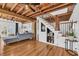 Inviting living room with exposed wood beams, wood floors, and staircase at 1901 10Th St, St Cloud, FL 34769