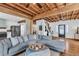 Spacious living room featuring hardwood floors, comfortable seating, and open access to the kitchen at 1901 10Th St, St Cloud, FL 34769