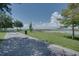 Scenic community walking path next to the water with shade trees and lush green space at 1901 10Th St, St Cloud, FL 34769