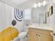Stylish bathroom with modern fixtures, a decorative shower curtain, and contemporary design elements at 2110 Hillcrest St, Orlando, FL 32803