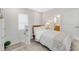 Bright bedroom features neutral tones, a comfortable bed, and ample natural light from the windows at 2110 Hillcrest St, Orlando, FL 32803