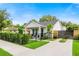 Beautifully landscaped home featuring a modern fence and an extended driveway for easy access at 2110 Hillcrest St, Orlando, FL 32803