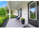 Inviting front porch with comfortable seating, perfect for enjoying the outdoors and neighborhood views at 2110 Hillcrest St, Orlando, FL 32803