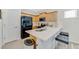Bright kitchen featuring wood cabinets, stainless steel appliances, and a spacious countertop at 2110 Hillcrest St, Orlando, FL 32803