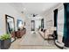 Spacious living room with a cozy rug, contemporary furniture and a dark accent wall at 2110 Hillcrest St, Orlando, FL 32803