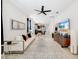 Bright living room featuring contemporary furnishings, an open floor plan and modern ceiling fan at 2110 Hillcrest St, Orlando, FL 32803
