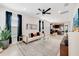 Bright and open living room with stylish furnishings and view to kitchen at 2110 Hillcrest St, Orlando, FL 32803