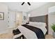 Bright main bedroom with accent wall, minimalist decor, and wood flooring at 2110 Hillcrest St, Orlando, FL 32803