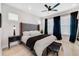Bright main bedroom with accent wall, large windows, and modern decor at 2110 Hillcrest St, Orlando, FL 32803