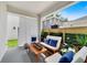 Inviting outdoor patio space with comfortable seating, privacy screen, and decorative plants at 2110 Hillcrest St, Orlando, FL 32803