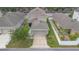 Home featuring a driveway and attached garage in an aerial view at 2136 J Lawson Blvd, Orlando, FL 32824