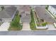 Home featuring a driveway and attached garage in an aerial view at 2136 J Lawson Blvd, Orlando, FL 32824