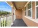 Balcony with dark floor and white railings at 2136 J Lawson Blvd, Orlando, FL 32824