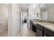 This bathroom features a double vanity with granite countertops, tile floors, and a walk-in shower at 2136 J Lawson Blvd, Orlando, FL 32824
