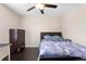 This bedroom features a ceiling fan and hard wood floors, with space for a dresser and desk at 2136 J Lawson Blvd, Orlando, FL 32824